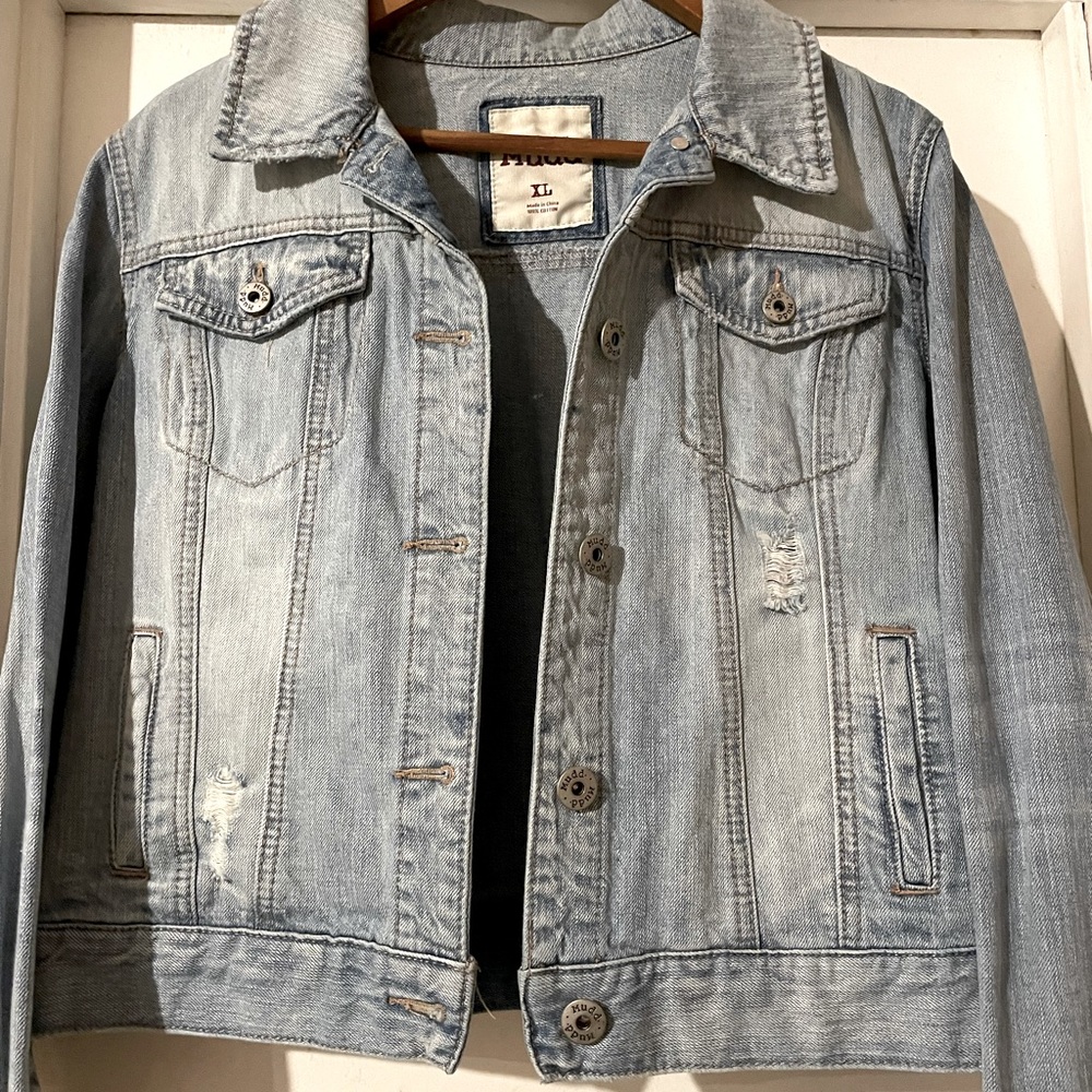 Short waisted distressed denim jacket